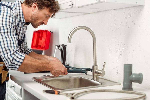 side-view-of-handsome-repairman-using-pipe-wrench-resize.jpg side-view-of-handsome-repairman-using-pipe-wrench-resize.jpg